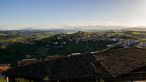 Cityscape with mountain range in background