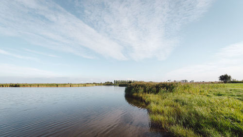 Scenic view of river against sky