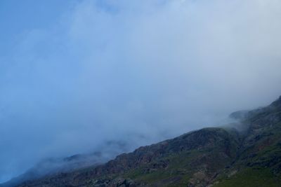 Scenic view of volcanic mountain against sky