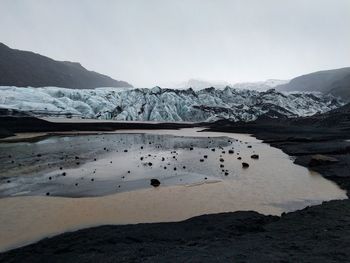 Scenic view of snowcapped mountains and gletsjer against sky