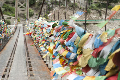 Colorful prayer flags on bridge