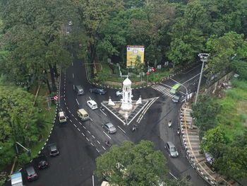 High angle view of street amidst trees in city