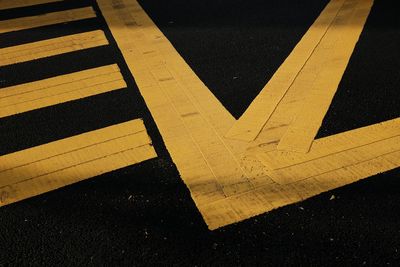 Close-up of arrow symbol on road