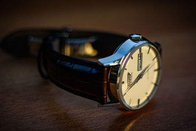 Close-up of clock on table