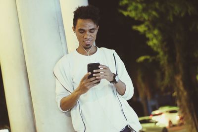 Young man using mobile phone