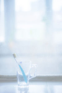 Close-up of glass of water on table