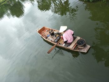 High angle view of woman floating on lake