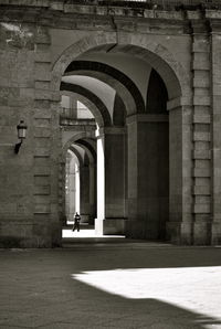 Full length of woman walking in tunnel