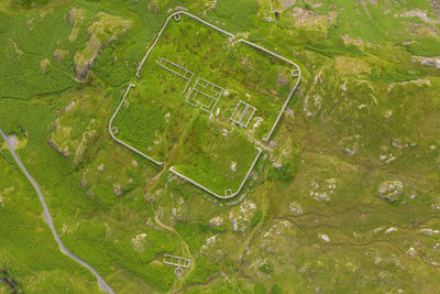 Aerial of hardknott roman fort is an archeological site, the remains of the roman fort mediobogdum, located on the western side of the hardknott pass in the english county of cumbria