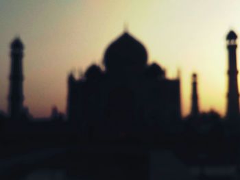 Silhouette of cathedral against sky during sunset