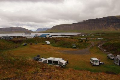 Scenic view of land and mountains against sky