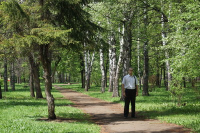 Woman walking in forest