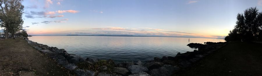 Scenic view of lake against sky during sunset