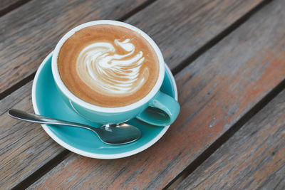 High angle view of cappuccino on table