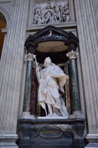 Low angle view of statue against building