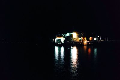 Reflection of illuminated buildings in water