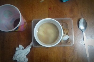 High angle view of coffee cup on table