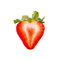 Close-up of strawberry over white background