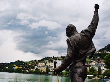 Low angle view of statue against cloudy sky
