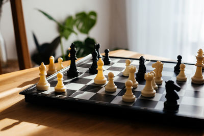 Close-up of chess pieces on table