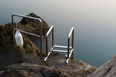 High angle view of entrance on rocks by sea