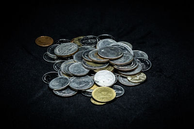 High angle view of coins on table