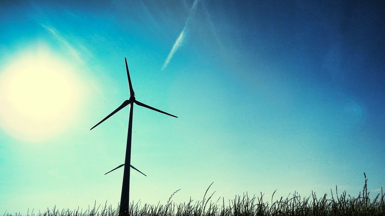 wind power, wind turbine, alternative energy, renewable energy, windmill, environmental conservation, clear sky, blue, sun, low angle view, fuel and power generation, field, sunlight, rural scene, nature, tranquility, landscape, beauty in nature, sky, tranquil scene