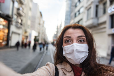 Portrait of woman on street in city
