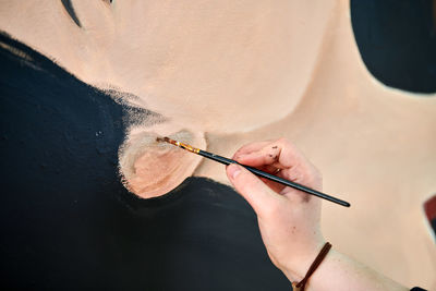 High angle view of woman painting