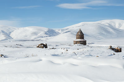 View of tower on snow covered landscape