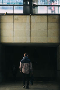 Rear view of man standing outdoors