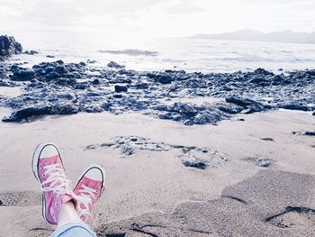 Low section of woman at beach