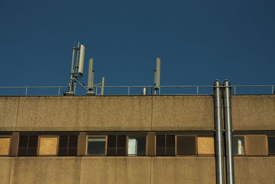 Low angle view of building against clear blue sky