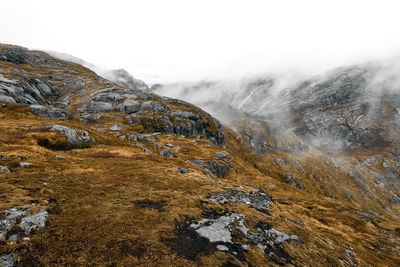 Rock formations on landscape against sky in lofoten norway