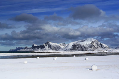 Scenic view of snowcapped mountains against sky