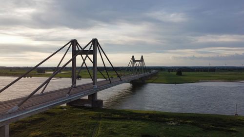 Bridge over river against sky