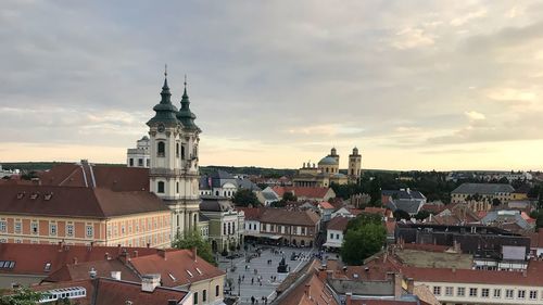 High angle view of buildings in town against sky