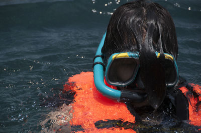 Portrait of man swimming in sea