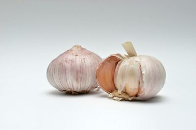 Close-up of pumpkins against white background