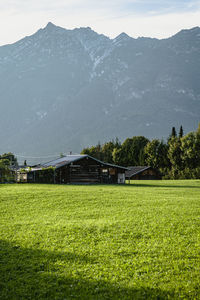 Scenic view of field against mountain