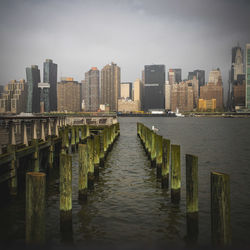 River amidst buildings against sky in city
