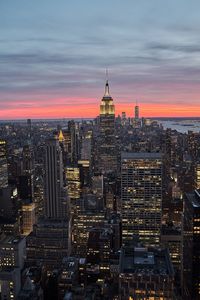 Aerial view of city buildings during sunset