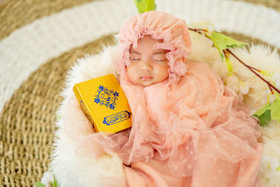 High angle view of young woman in plastic bag