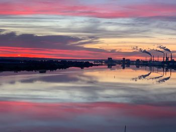 Scenic view of sea against orange sky