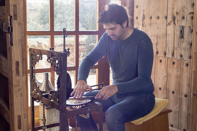 Middle aged man cooking homemade artisan pastries.