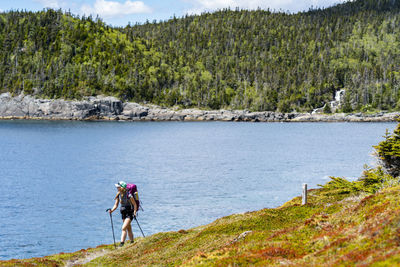 Female backpacking along east coast trail in newfoundland