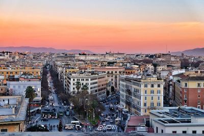 High angle view of city at sunset
