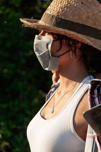 Side view of woman wearing mask