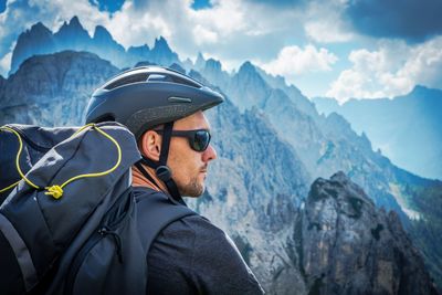 Man with backpack standing on mountain