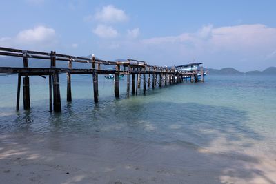 Pier over sea against sky